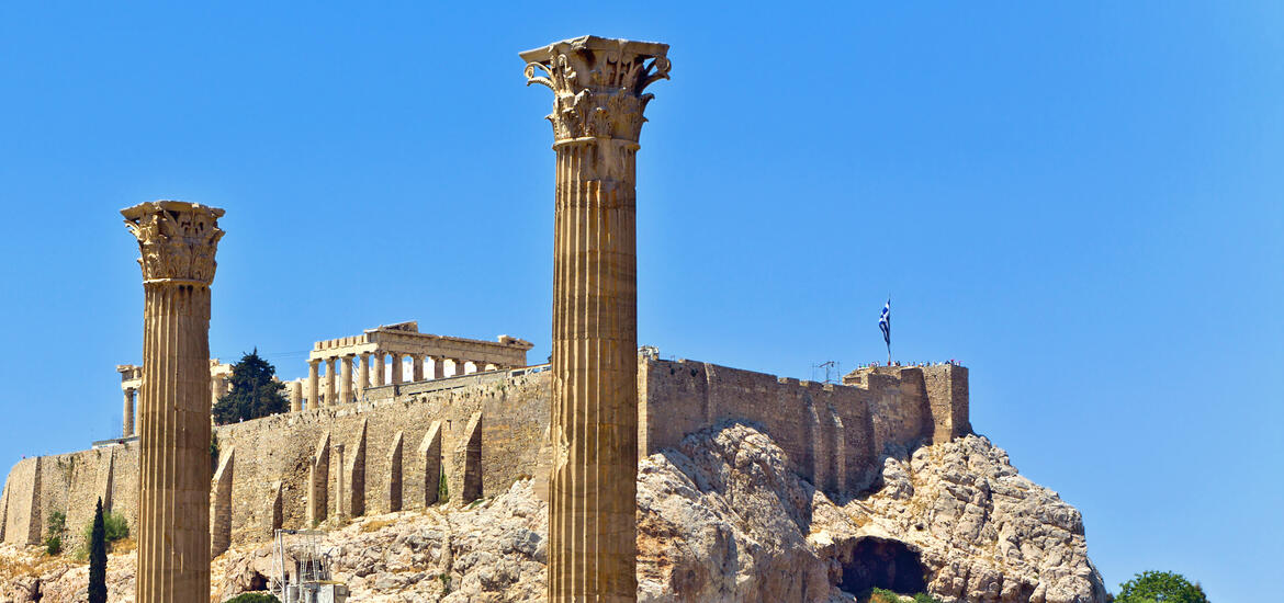 The ancient columns of the Temple of Olympian Zeus with the Acropolis in the background