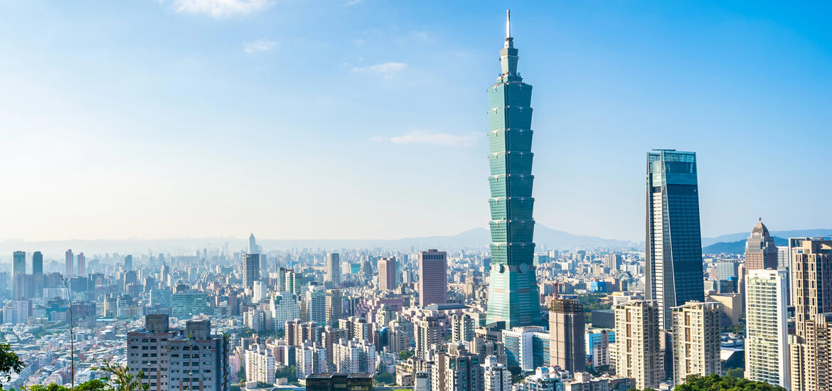 A view of Taipei with the iconic Taipei 101 skyscraper, surrounded by other high-rise buildings of the city in the background 