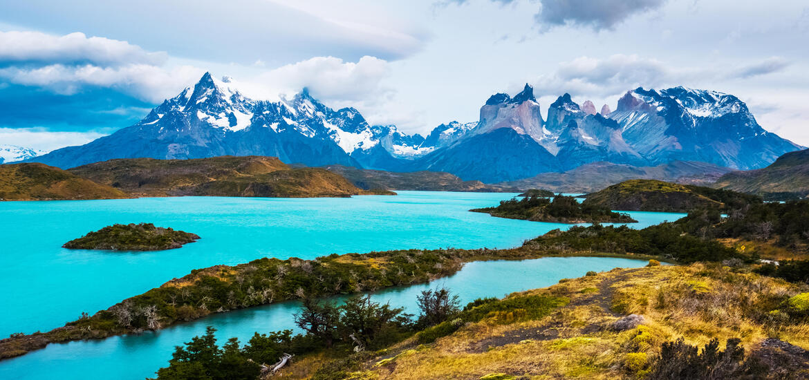 A view of the turquoise lakes and snow-capped mountains in Torres del Paine National Park, Chile