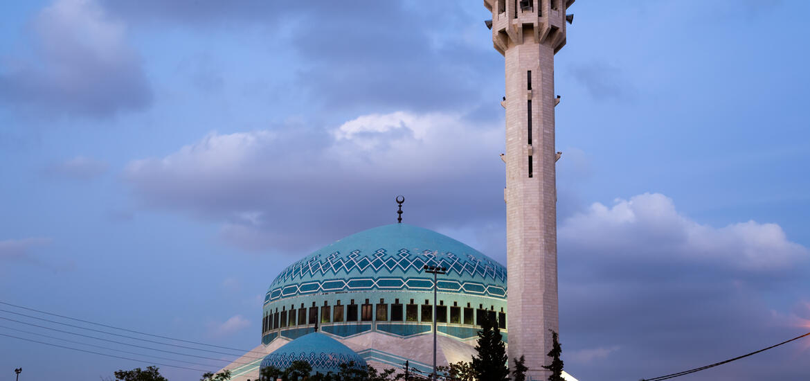 The King Abdullah Mosque in Amman, Jordan, with its large blue dome and tall minaret