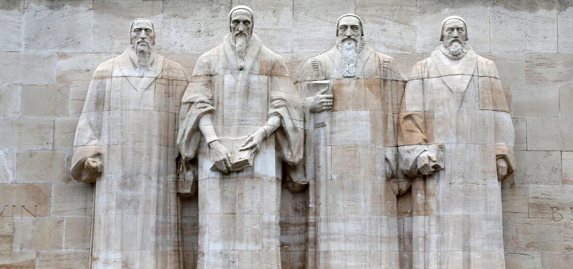 The Reformation Wall in Geneva, featuring stone sculptures of prominent Reformation figures, commemorating the leaders of the Protestant Reformation