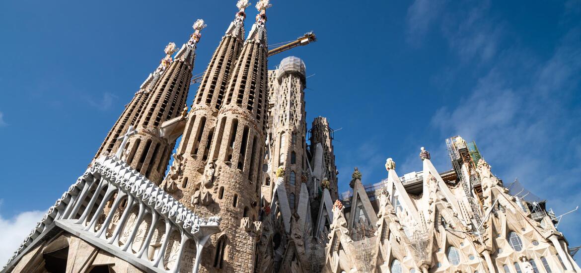 A view of La Sagrada Familia in Barcelona, featuring its intricate spires and detailed facades