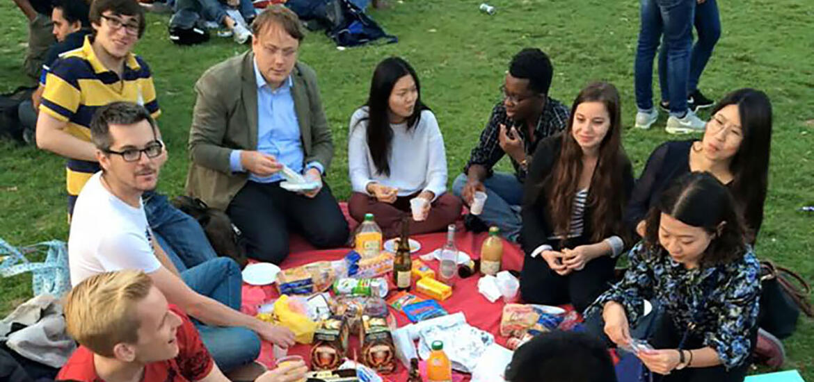 A group of students sitting and having a lively class discussion