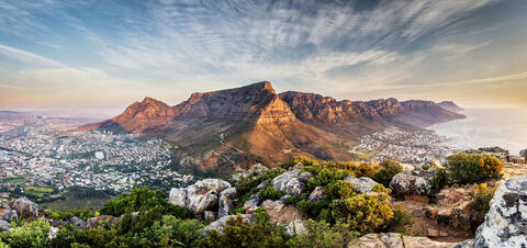 Panoramic view of Cape Town, with Table Mountain and the Twelve Apostles range overlooking the coastline