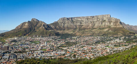 An aerial view of Cape Town, South Africa with Devil's Peak and Table Mountain in the background