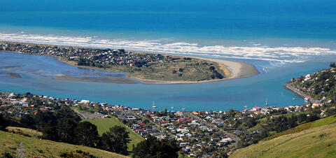 Southside Beach, Christchurch, New Zealand An aerial view of Southside Beach in Christchurch, New Zealand, showing the coastline, a riverbend, and residential areas