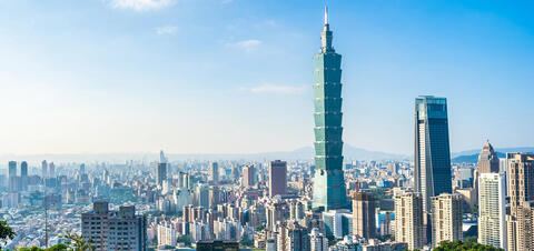 A view of Taipei with the iconic Taipei 101 skyscraper, surrounded by other high-rise buildings of the city in the background 