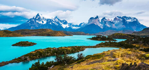 A view of the turquoise lakes and snow-capped mountains in Torres del Paine National Park, Chile