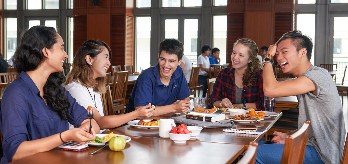 Students enjoying thier meal in a dining hall